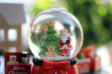 Snow Globe with Santa Claus. Christmas or New Year gift, Close up view, selective focus