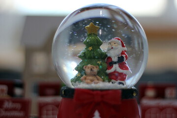 Snow Globe with Santa Claus. Christmas or New Year gift, Close up view, selective focus