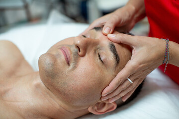 Obraz na płótnie Canvas Non-surgical facelift for man - Italian modeling massage Gym