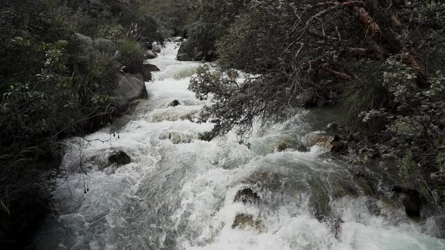 lively river on the way to the laguna Paron in the high altitude of the cordillera blanca in remote Andes of Peru.