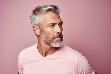 Portrait of a blissful man in his 50s donning a trendy cropped top against a pastel or soft colors background. AI Generation
