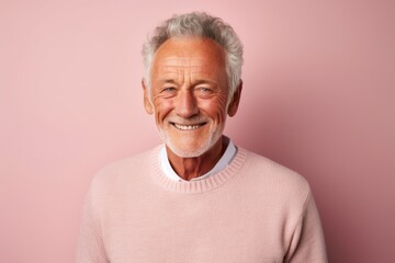 Portrait of a happy man in his 70s wearing a thermal fleece pullover against a pastel or soft colors background. AI Generation