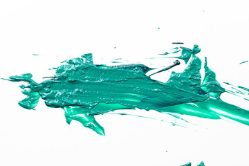 Acrylic paint blot, chaotic brushstroke, spot flowing on white paper background. Creative green color backdrop, fluid art.