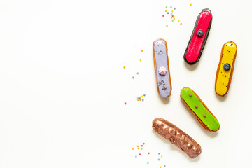 Sweet food pattern with many icing eclairs cakes