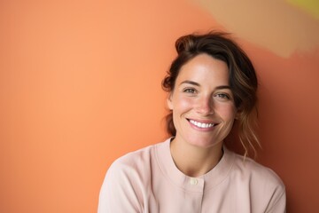 Portrait of a grinning woman in her 30s sporting a long-sleeved thermal undershirt against a solid pastel color wall. AI Generation