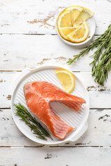 raw salmon steak with lemon