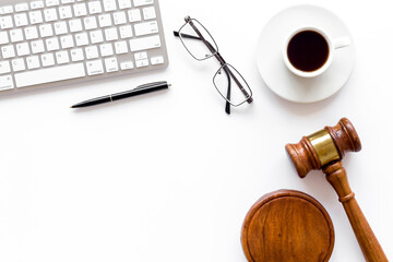 Lawyer desktop with Judge gavel and coffee cup