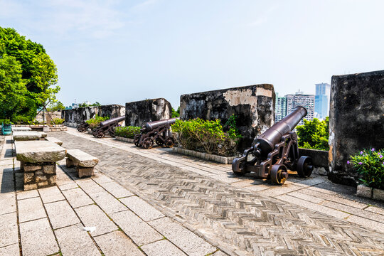 Macau- September 18, 2019: Replica cannon and defense wall of Mount Fortress, Fortaleza do Monte, between Nature. Santo António, Macao.