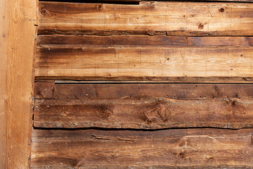 The background is made of wide wooden boards. Old brown rustic dark grunge wooden timber wall or...