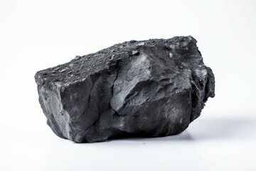 Single coal ember on white surface