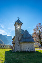 albania theth national park and stone church among mountains blue sky over valley