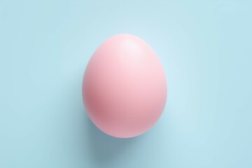 Naklejka na ściany i meble Minimal fashion concept with a pink egg on light blue pastel background