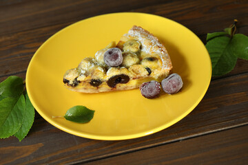 Delicious Quiche pie with cherry filling on yellow plate