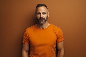 Fototapeta premium Portrait of a content man in his 40s donning a trendy cropped top against a plain cyclorama studio wall. AI Generation