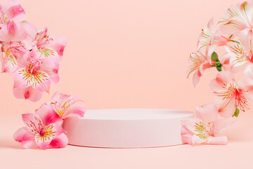 Empty podium with pink flowers on pink background. Showcase for cosmetic, design and product...