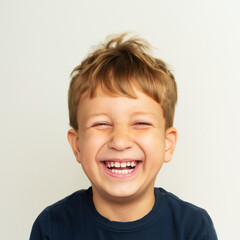 Smiling young blonde kid with open mouth and a fuzzy hair