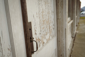 Close-up of an old wooden door on a storefront