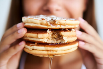 A Woman's Lips Enjoying a Stack of Fluffy Pancakes with Sweet Syrup Drizzle AI generated