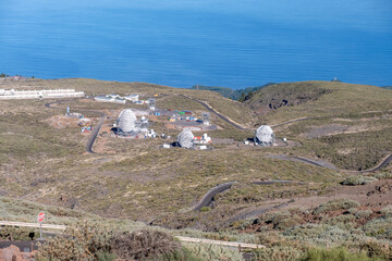 View on international space observatory and telescopes on La Palma island located on highest mountain range Roque de los muchachos, sunny day, Canary islands, Spain - 678240607
