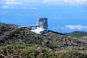 View on international space observatory and telescopes on La Palma island located on highest mountain range Roque de los muchachos, sunny day, Canary islands, Spain - 678240870