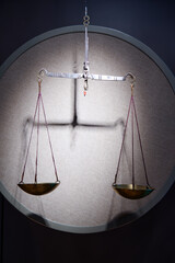 Ancient vintage brass scales on the grey background.
