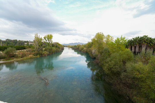 Transparent waters of Kopru River (K&ouml;pr&uuml;&ccedil;ay, ancient Eurymedon) with its emerald green colour in Koprulu Canyon (K&ouml;pr&uuml;l&uuml; Kanyon) National Park, Antalya, Turkey