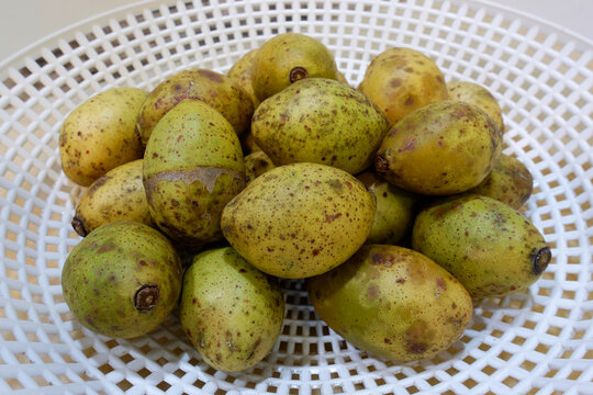 Ripe Spondias pinnata fruits also known as Hog plum or wild mango .
