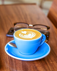 cup of coffee on the wooden table