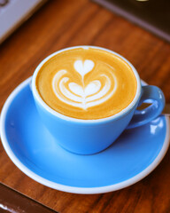 blue cup of coffee on the table