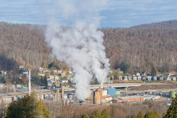 Bradford, Pennsylvania  overlooking  oil refinery, late autumn sunny day, global worming pollution theme