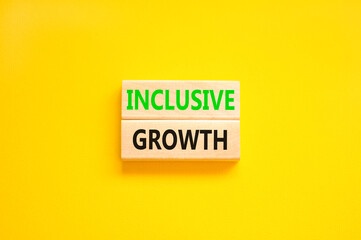 Inclusive growth symbol. Concept words Inclusive growth on beautiful wooden blocks. Beautiful yellow table yellow background. Business inclusive growth concept. Copy space.