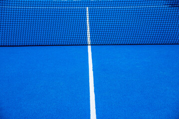 Fototapeta na wymiar Net on a blue paddle tennis court