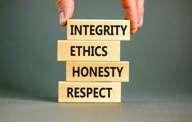 Integrity ethics honesty respect symbol. Concept word Integrity Ethics Honesty Respect on block....