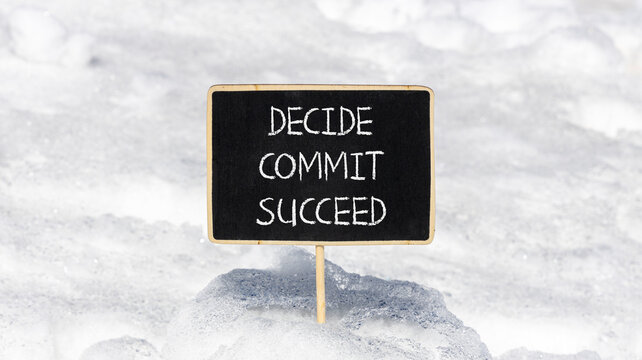 Decide commit succeed symbol. Concept word Decide Commit Succeed on beautiful black chalk blackboard. White snow. Beautiful white snow background. Business decide commit succeed concept. Copy space.