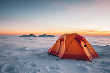 Tent pitched on icy summit at dusk background with empty space for text 