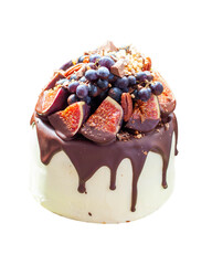 Delicious cake with figs dipped into melted chocolate, pecan nuts, grapes, chocolate bites and cookies on the top. Concept of autumn or summer cake