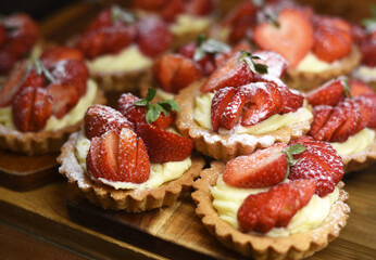 Cakes with cream and strawberries