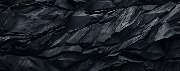 A macro shot of a black lava stone surface with an abstract twist, emphasizing the natural...