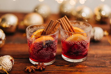 Cozy close-up of two glasswes with mulled wine. Christmas drink
