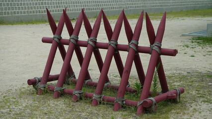 Traditional red wooden barricade on the ground