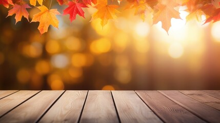 Naklejka na ściany i meble Autumn background, orange maple leaves on wooden table on soft focus light and glowing bokeh background.