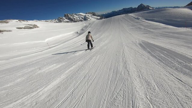  Skier girl sliding down the slopes of the German Alps