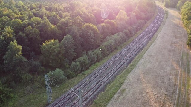 Train tracks through German forest near Munich aerial drone view fotage