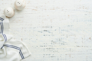 Food cooking empty background. Cooking kitchen napkin, salt and pepper shakers on old white...