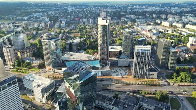 Green capital Vilnius of Lithuania. Urbanistic. Modern area. Day Aerial video of downtown Vilnius in Lithuania on a sunny day. New skyscraper district, financial buildings