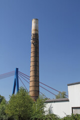Chimney of the old Hockenheim brickworks with the Rhine bridge in the background