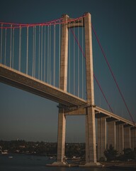 Fototapeta premium Vertical of a bridge against the evening sky