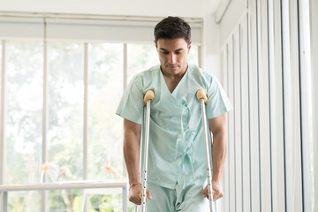 Patient man using walker at hospital ward. Patient man using walker for walk in hospital room