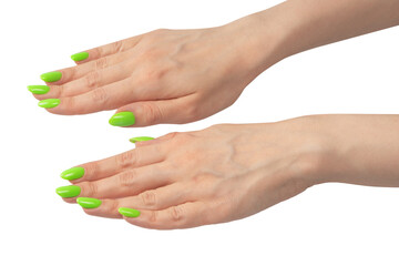 Hand of a woman with green naols hold some tiny or thin object.