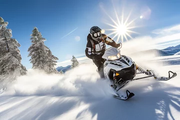 Zelfklevend Fotobehang a guy rides a Snowmobile against the background of a winter forest, leaving a trail of splashes of white snow. a bright snowmobile and a suit without brands. Extreme sports. Banner © Irina